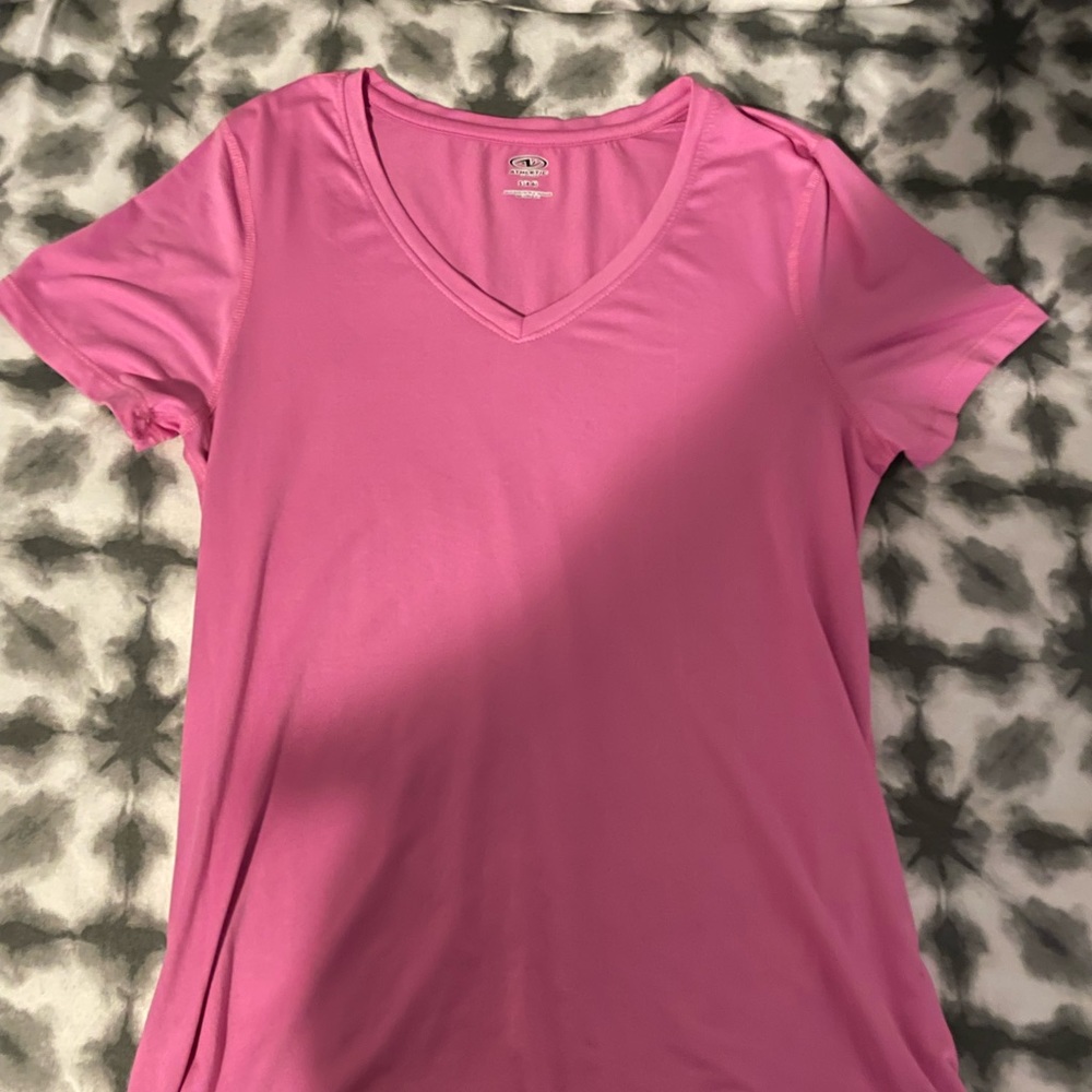 pink athletic top says size small but fits more like a medium